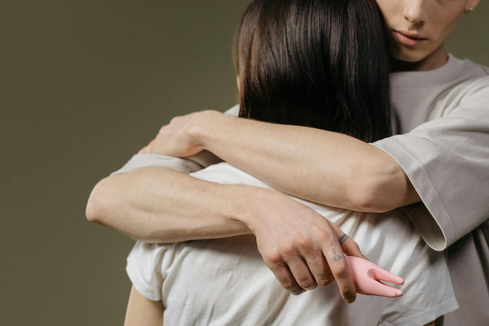 Close-up of a couple embracing, highlighting emotional and physical connection.