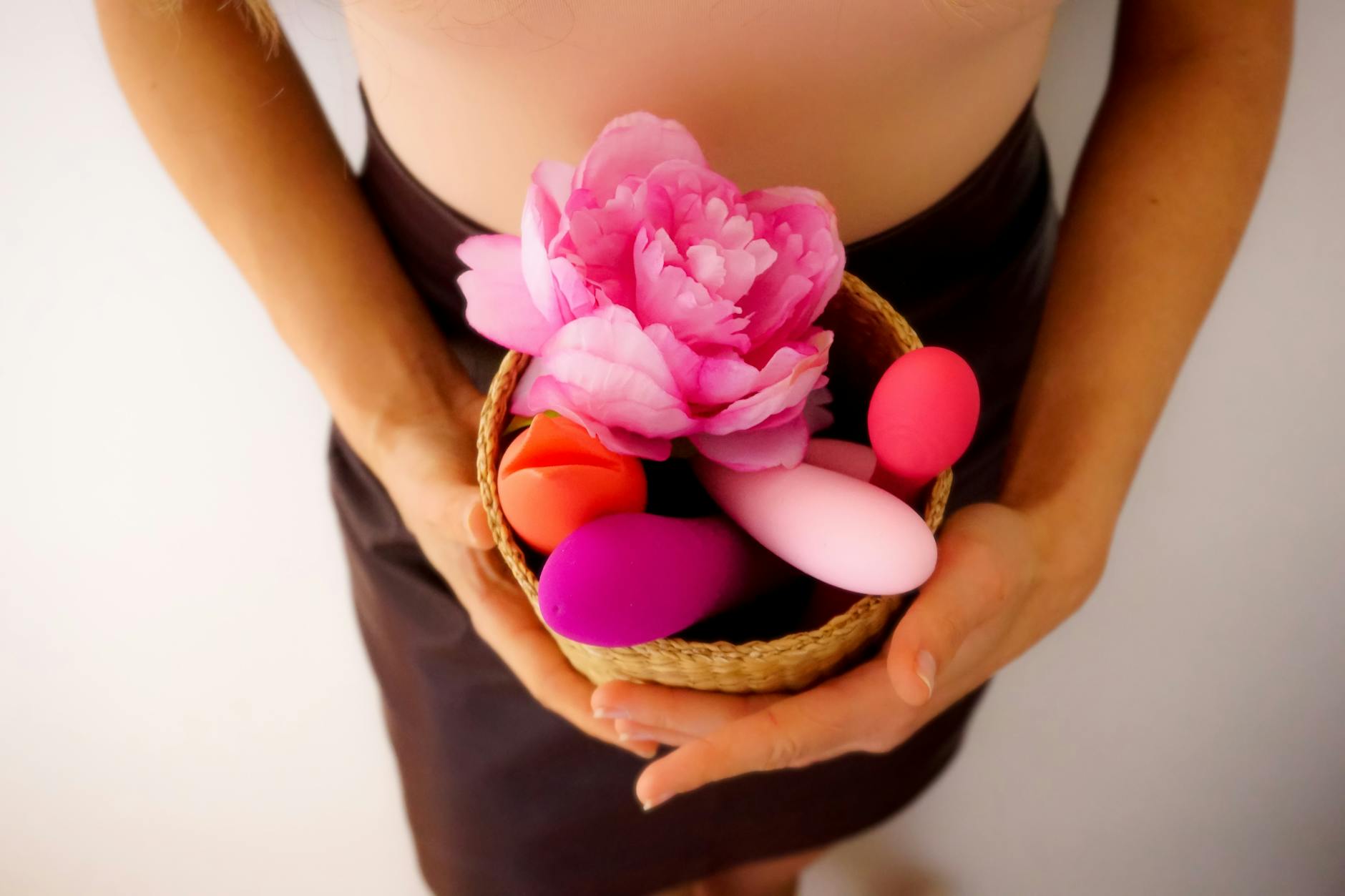 An array of vibrant adult toys including vibrators and rings in a close-up view