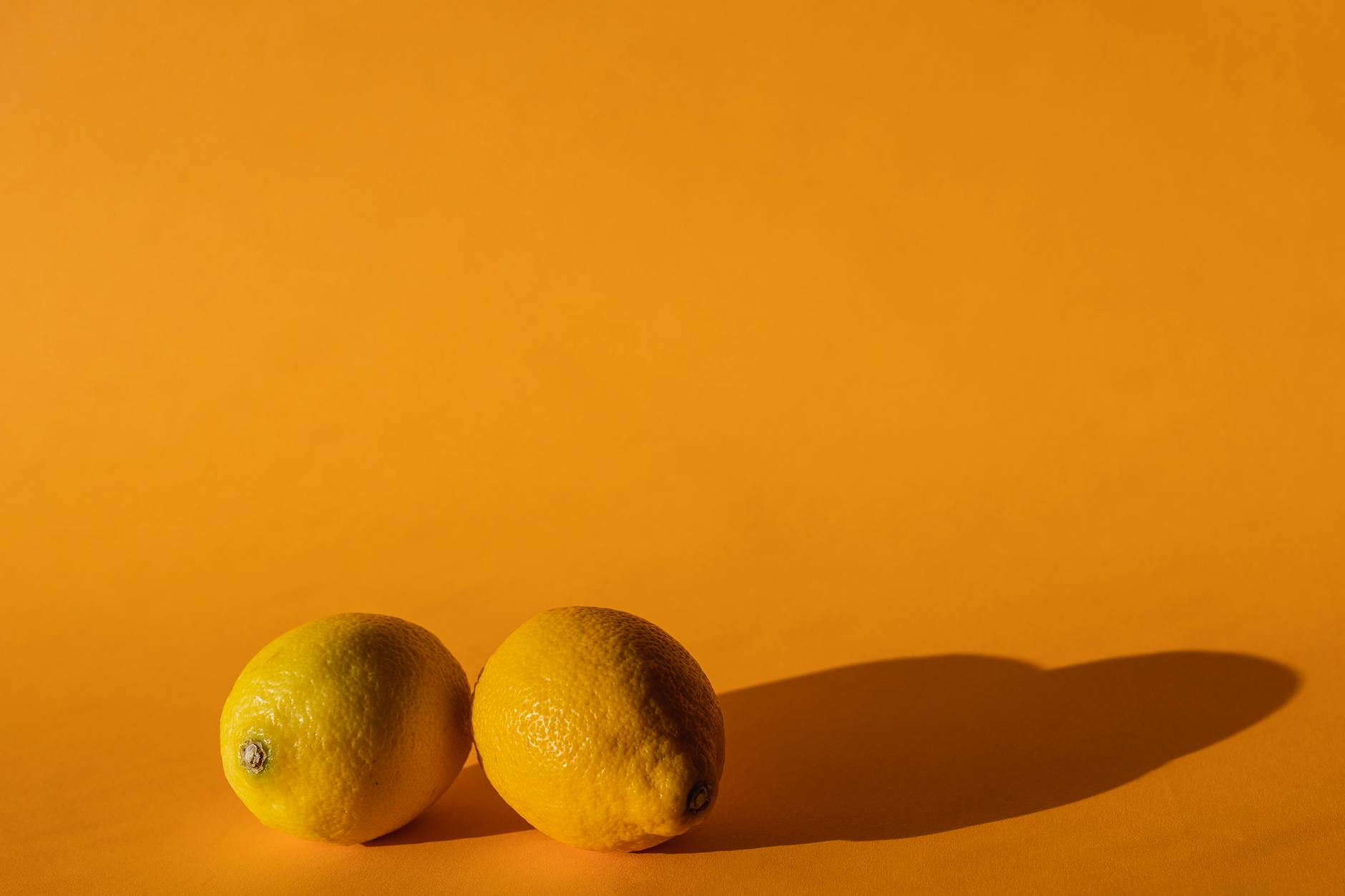 Vibrant adult toys arranged on a bright yellow surface showcasing design and diversity